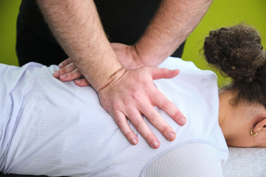 A female patient receives spinal decompression treatment at Tangelo.